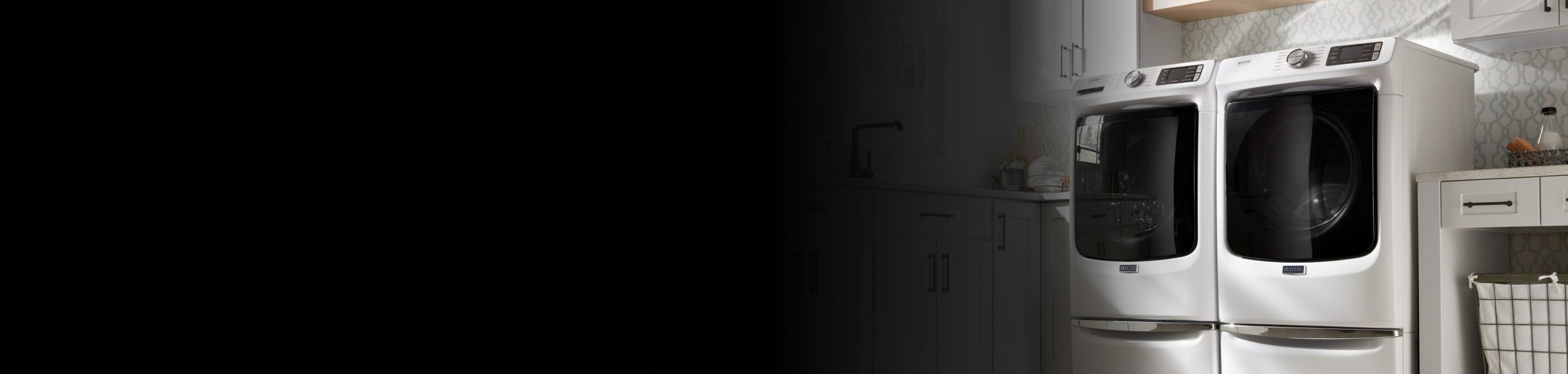 A white Maytag® dryer in a laundry room