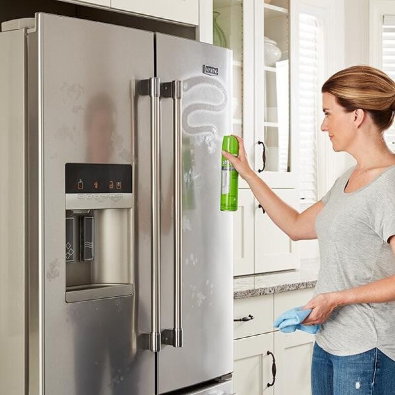 Person cleaning stainless steel with affresh® cleaner