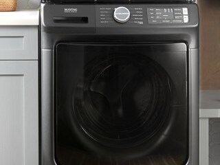 Front load dryer in a laundry room