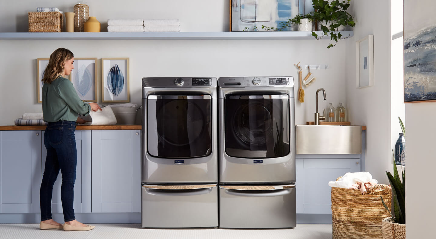 Person standing next to Maytag® laundry pair. Person standing next to Maytag® laundry pair.