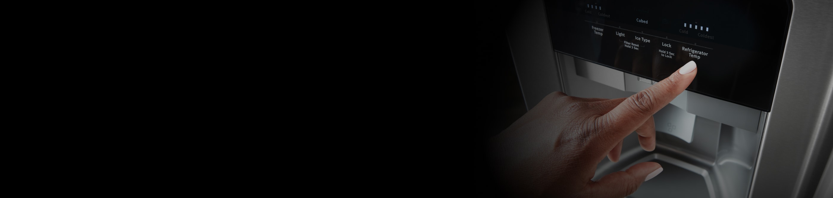 Person pressing a button on a refrigerator