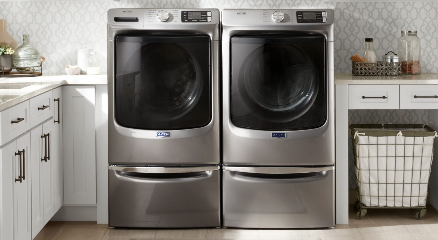 A Maytag® washer and dryer in a modern laundry room