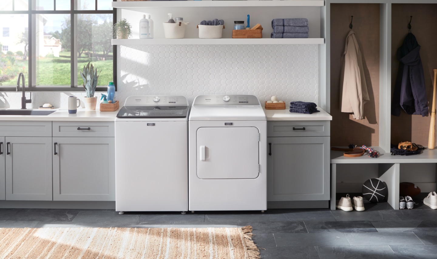 A washer and dryer pair in a modern laundry room A washer and dryer pair in a modern laundry room