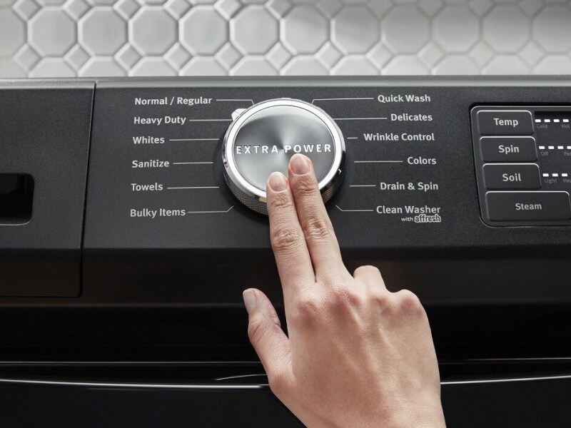 Hand pressing Extra Power button