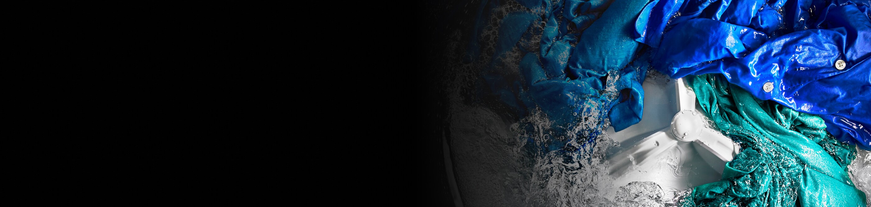 Action shot of a washing machine cleaning a load of laundry