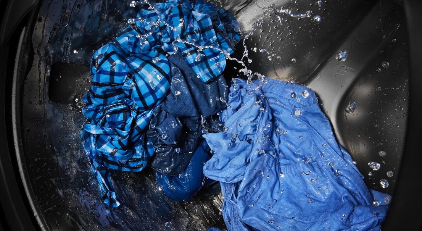 Action shot of a load of laundry in the washing machine Action shot of a load of laundry in the washing machine