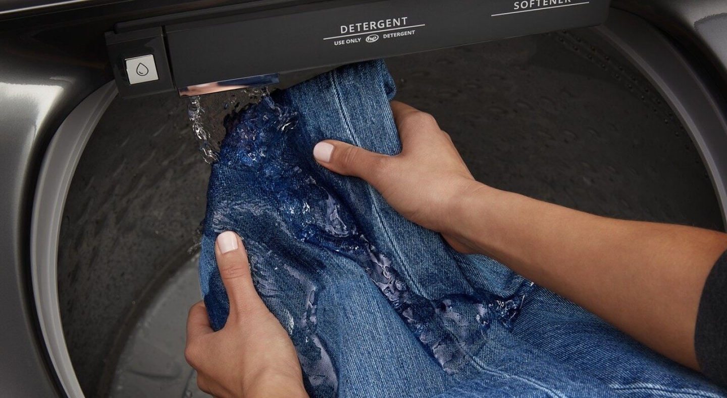 Hands pretreating denim with a built-in faucet Hands pretreating denim with a built-in faucet
