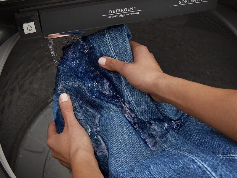 Hands pretreating denim with a built-in faucet Hands pretreating denim with a built-in faucet