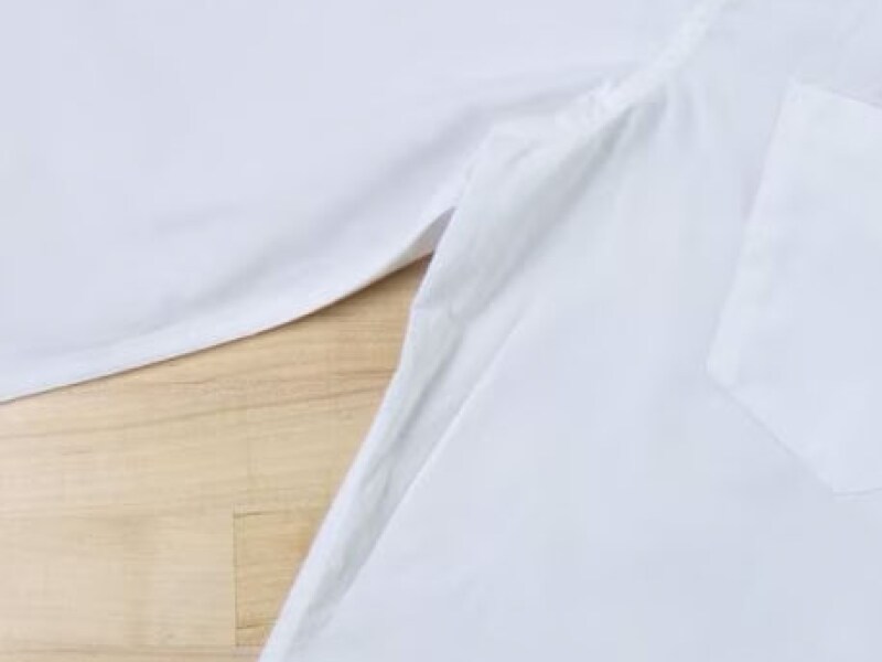 Close-up of pit stain on a white dress shirt