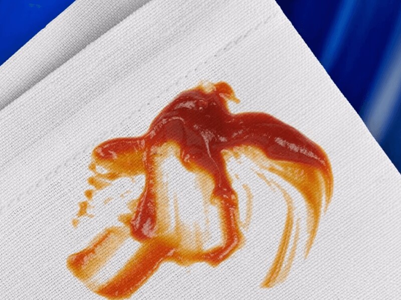 Ketchup stain on white canvas fabric