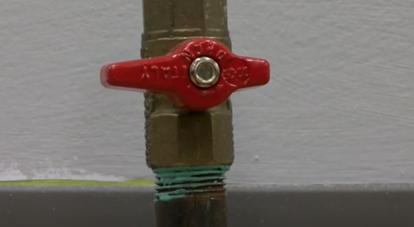 A closeup of gas stove shut-off valve A closeup of gas stove shut-off valve