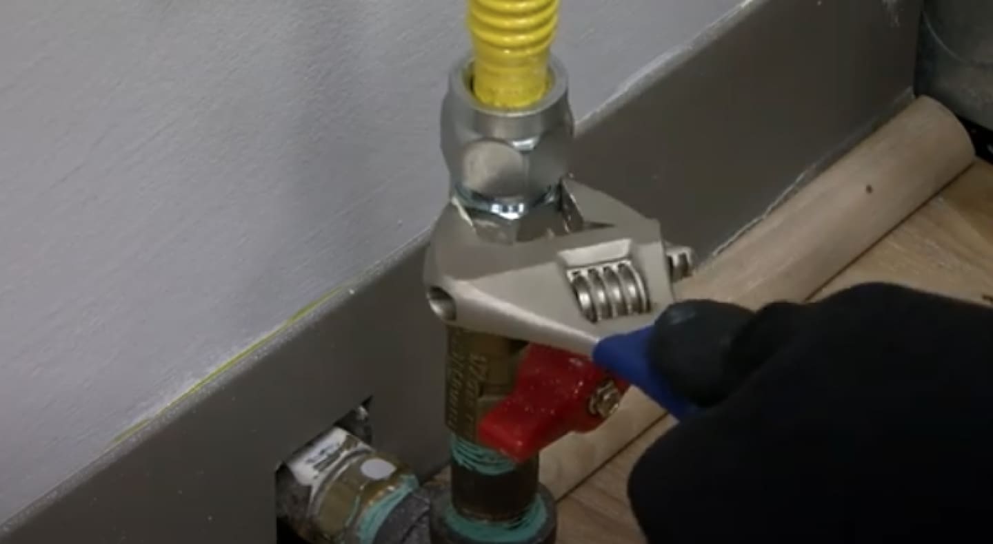 A closeup of a gas stove street elbow A closeup of a gas stove street elbow