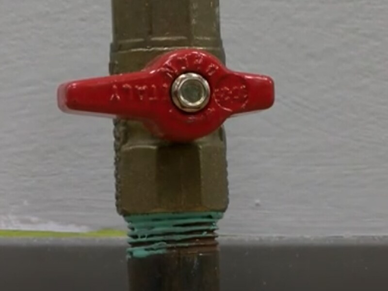 A closeup of gas stove shut-off valve A closeup of gas stove shut-off valve