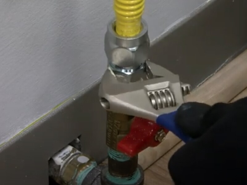 A closeup of a gas stove street elbow A closeup of a gas stove street elbow