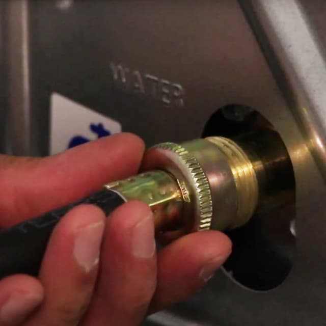 The water inlet hose is attached to a steam dryer