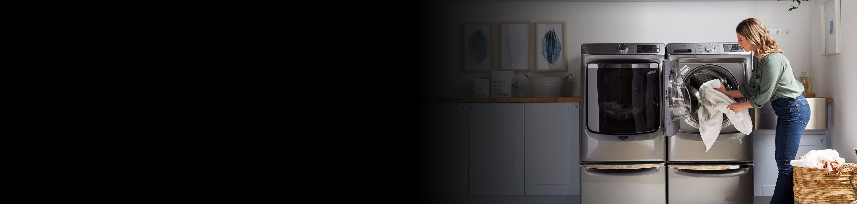 Person putting sheets in a Maytag® dryer