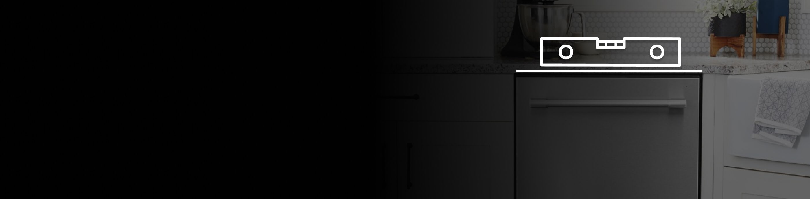 Maytag® dishwasher in a kitchen with a level on top.