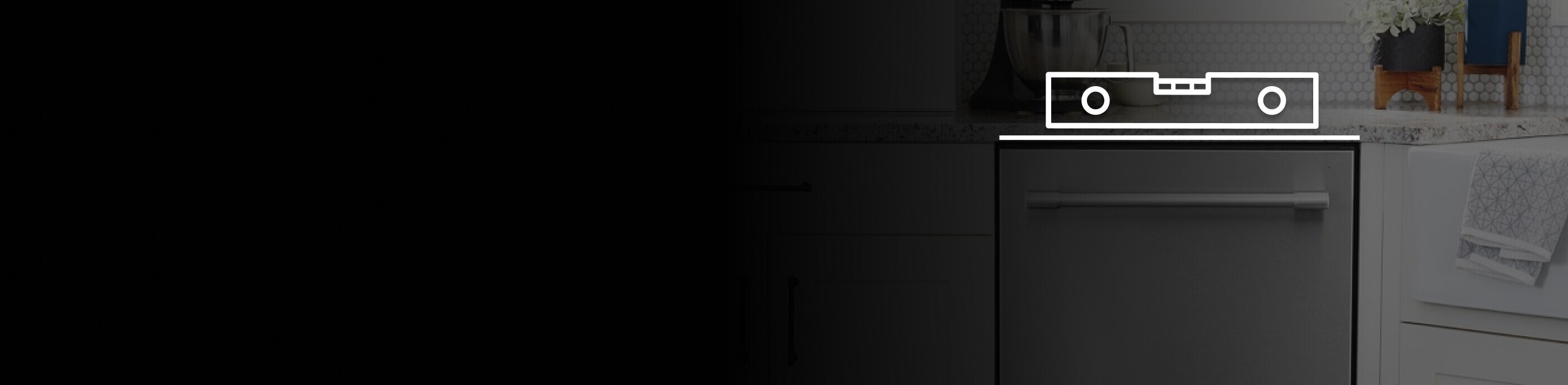 Maytag® dishwasher in a kitchen with a level on top. 