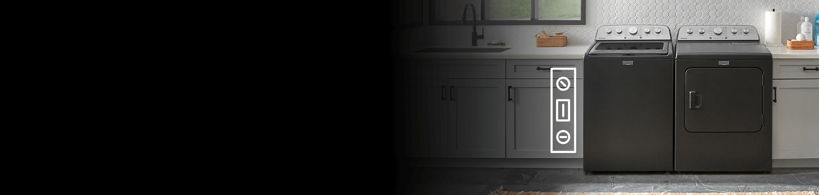 A black Maytag® washer and dryer surrounded by countertops