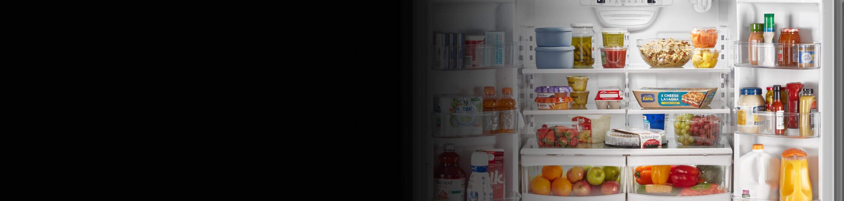 An open French door refrigerator filled with various foods