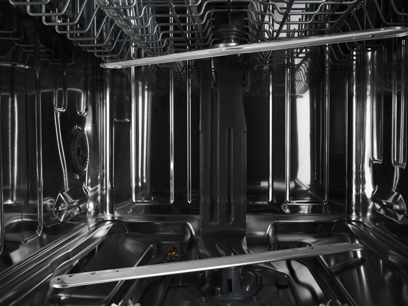 Stainless steel interior of a dishwasher.