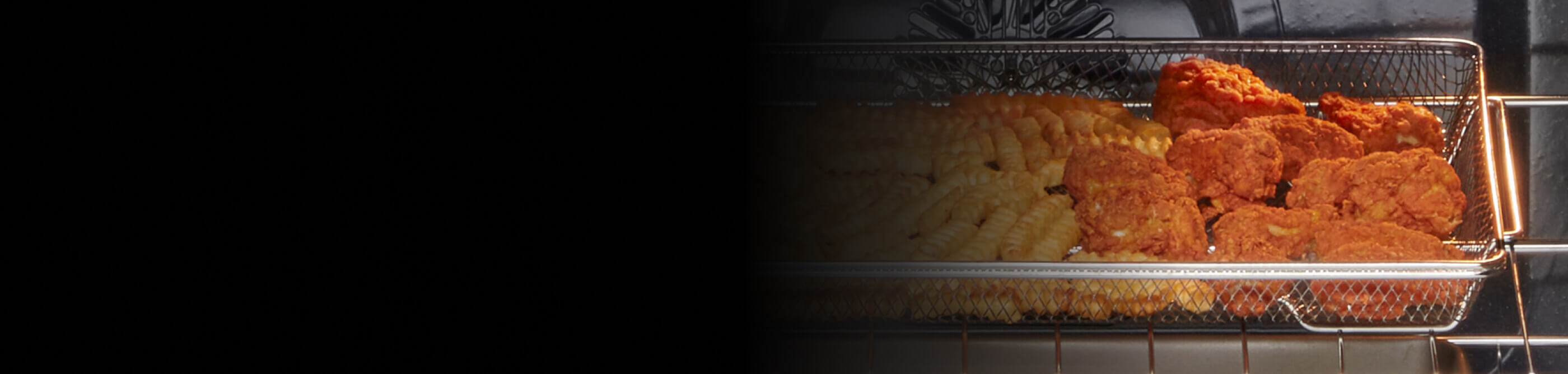 Fried chicken and fries in an air fry basket