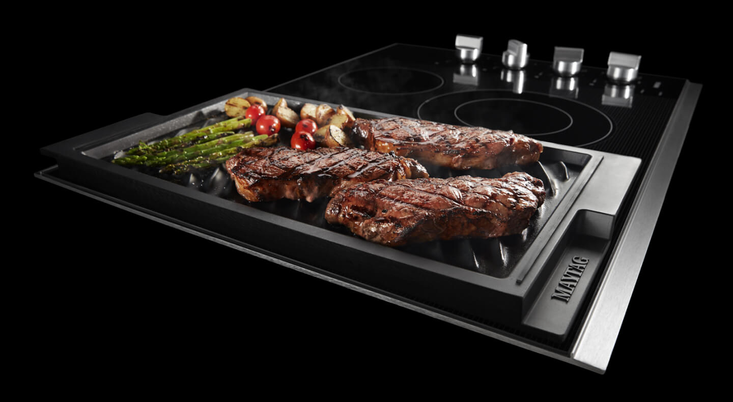 Steak and vegetables on a reversible griddle