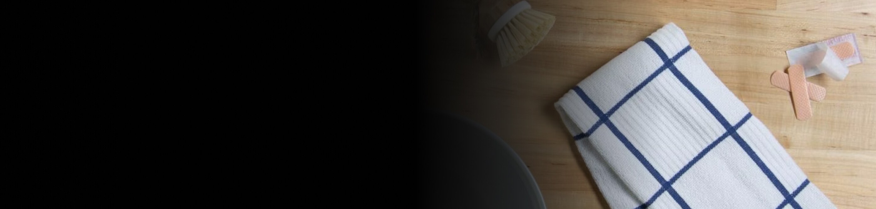 White washcloth next to first aid supplies