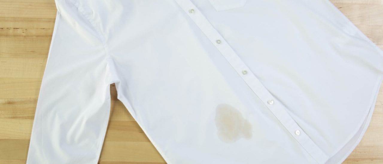 A white shirt with a coffee stain A white shirt with a coffee stain