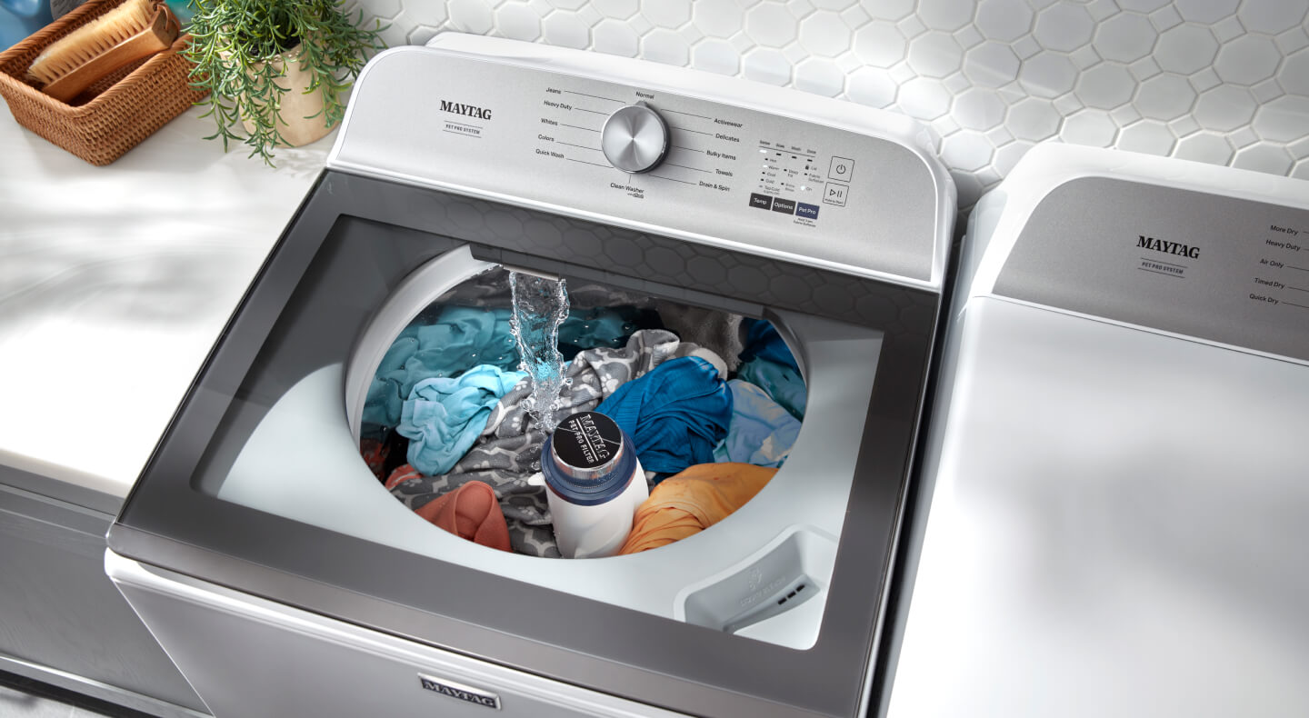 Water filling a white Maytag® top load washer