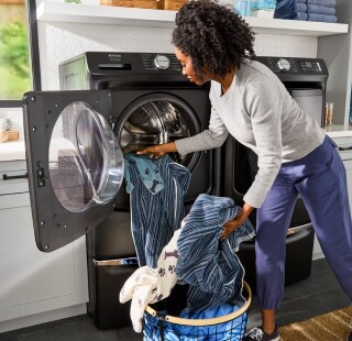 Person removing clothes from a washing machine