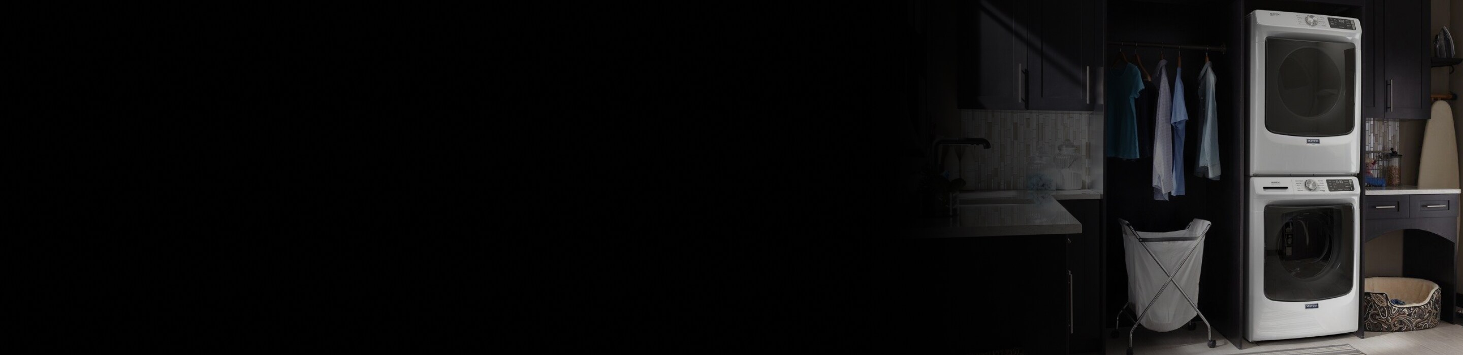 Stacked washer and dryer in laundry room