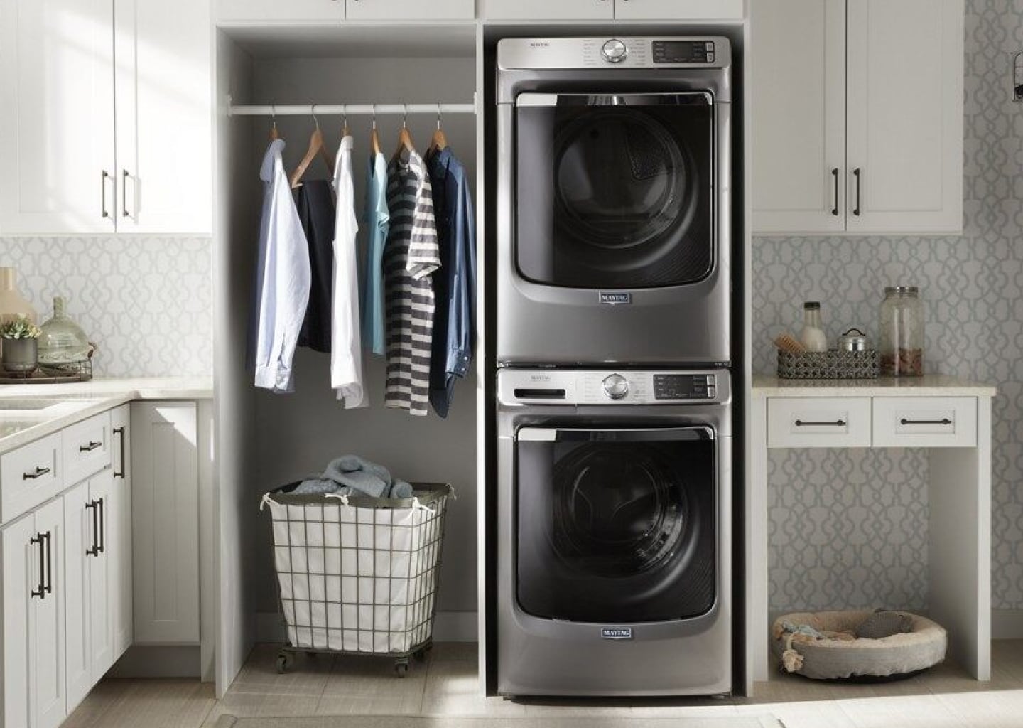 Stacked washer and dryer in a laundry room