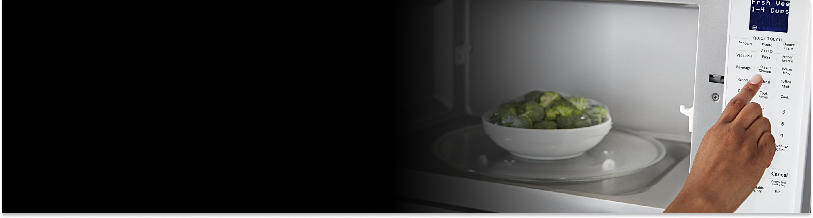 A person programming a Maytag® microwave with a bowl of broccoli