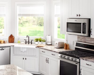 View of farmhouse kitchen with Maytag brand appliances