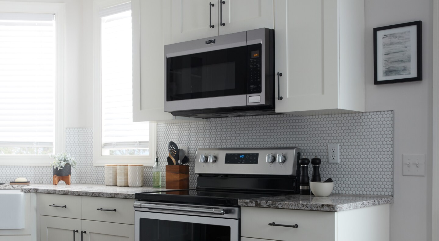 Closer view of Maytag brand stove and microwave