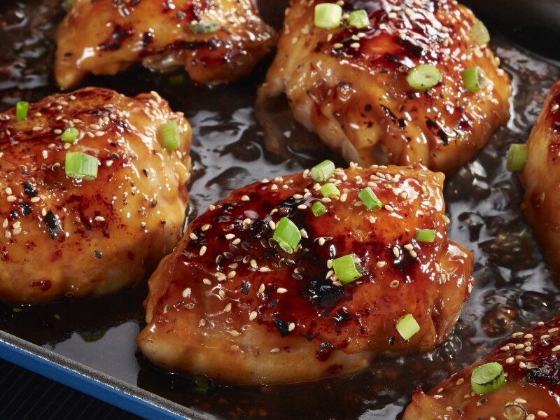 Close-up of teriyaki chicken sprinkled with sesame seeds and green onions Close-up of teriyaki chicken sprinkled with sesame seeds and green onions