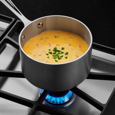 Soup simmering on a gas stovetop