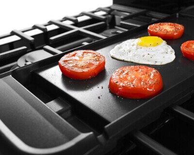 Food cooking on a stovetop griddle