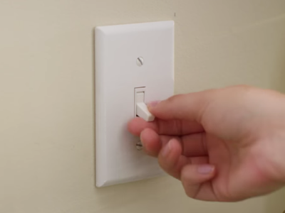 Person turning off a garbage disposal