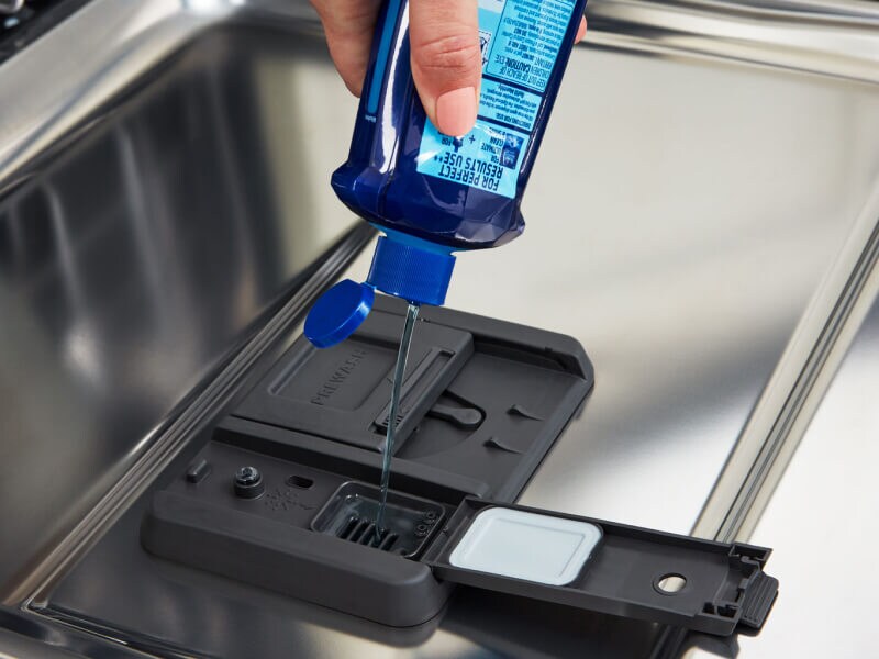 Adding rinse aid to a dishwasher 