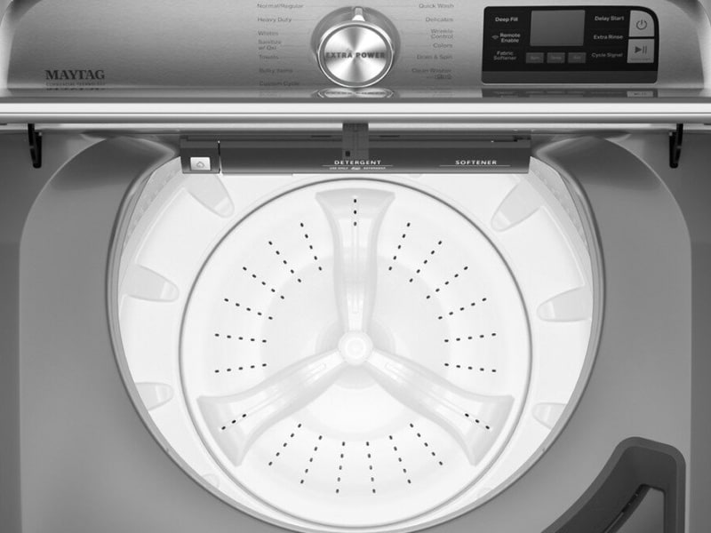 Open lid on a metallic slate Maytag® top load washer