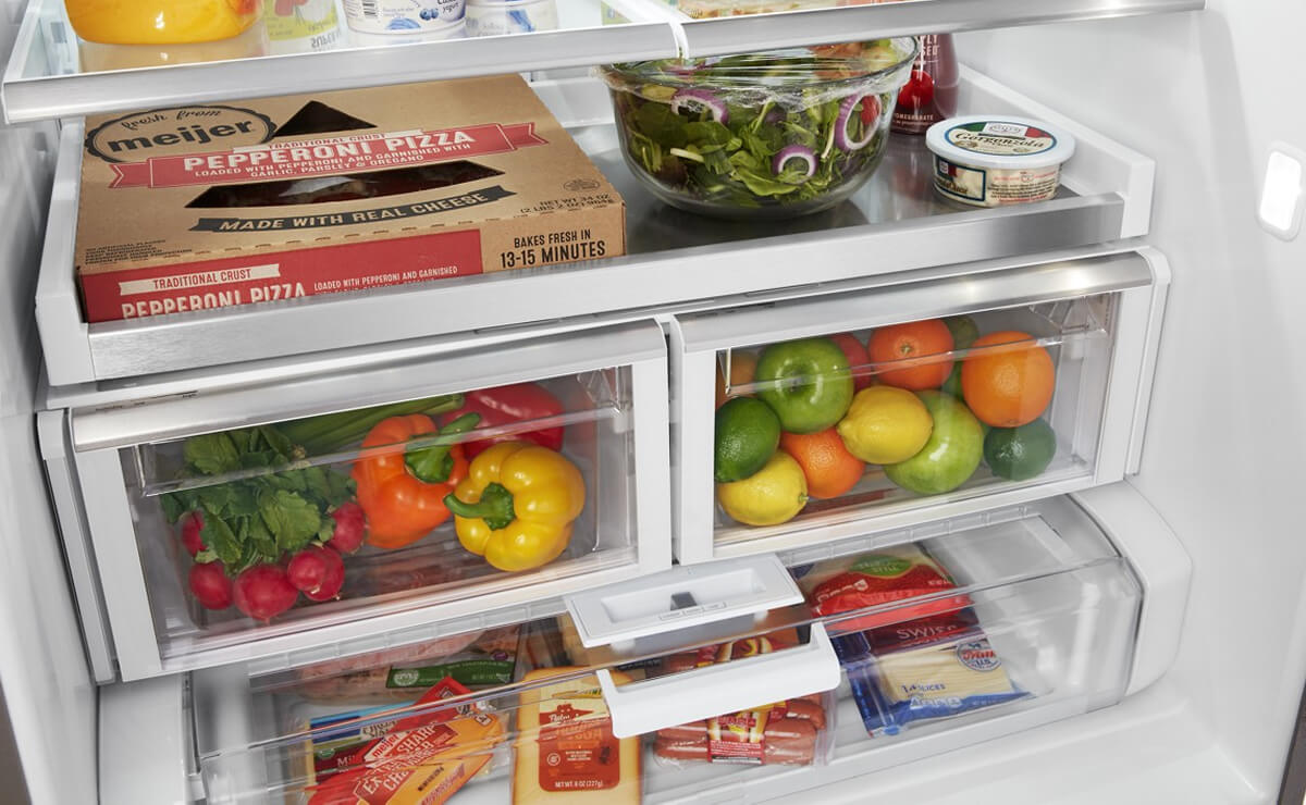 Crisper drawers full of produce and other foods
