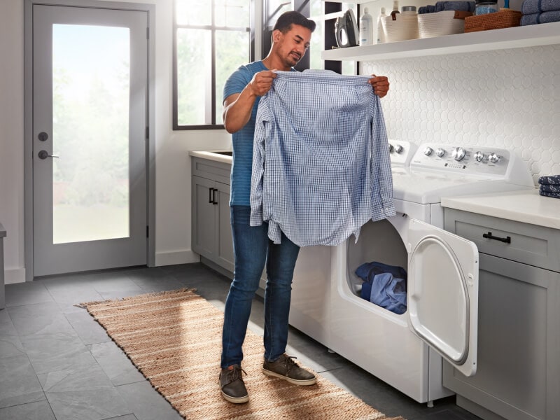 Person inspecting clean item Person inspecting clean item