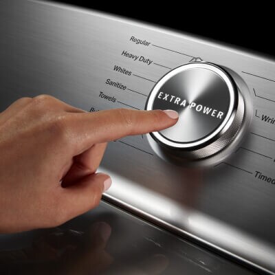 Person pushing the Extra Power button