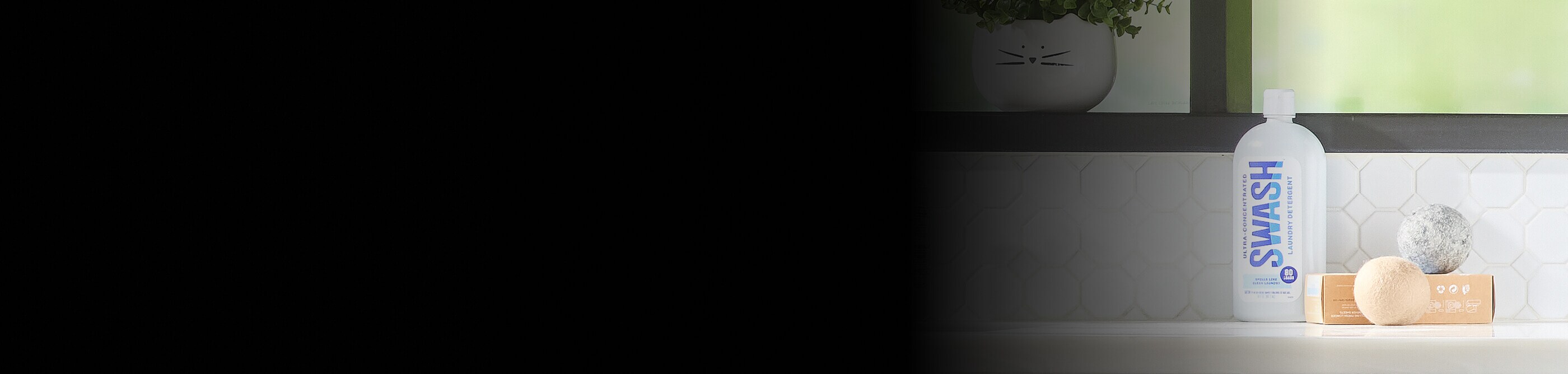 Swash® on a counter with wool dryer balls