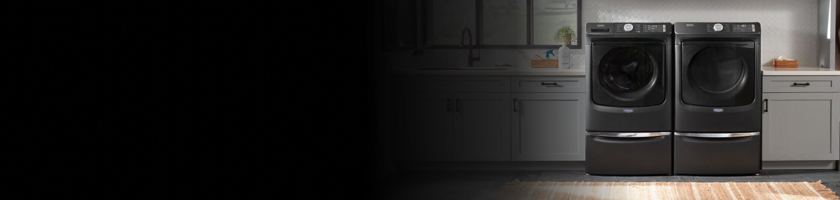 Maytag® side-by-side washer and dryer set in a modern laundry room