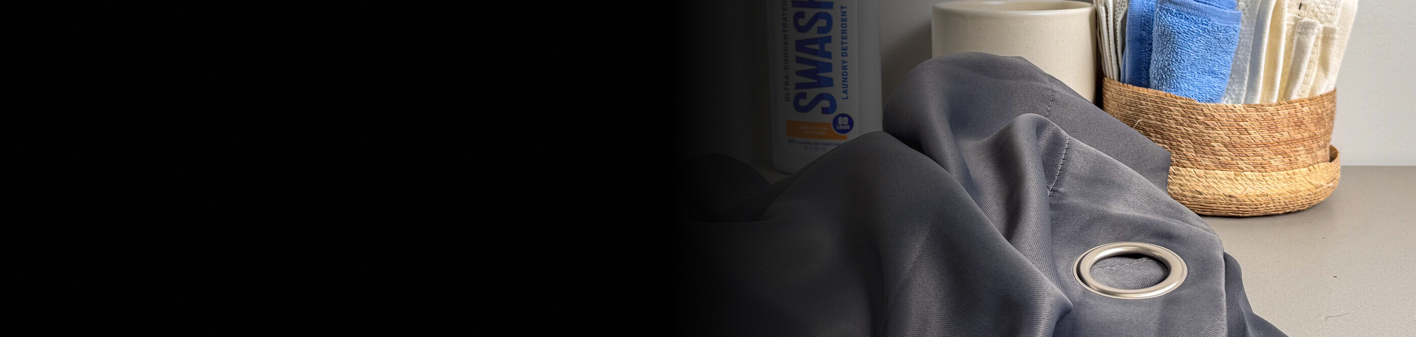 Curtain fabric on a table with cleaning supplies