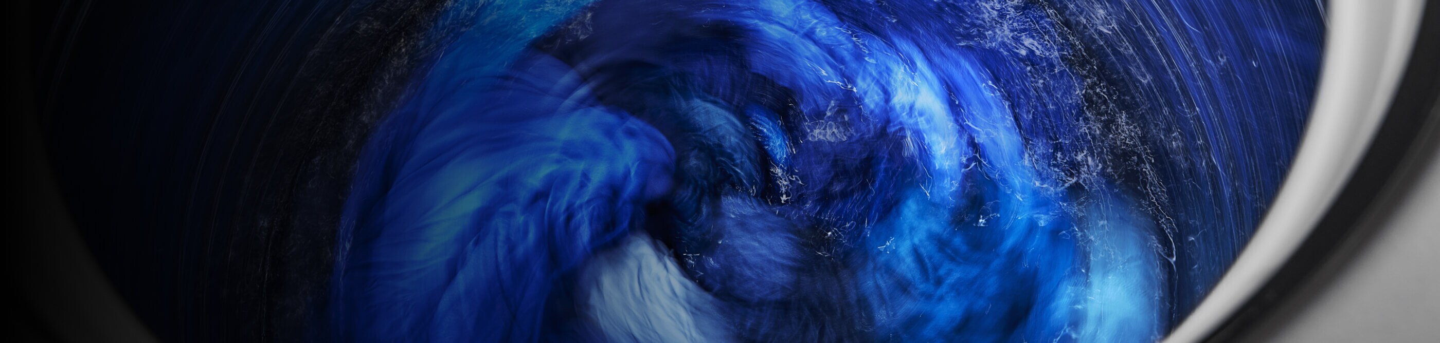 Wet blankets spinning in a washer