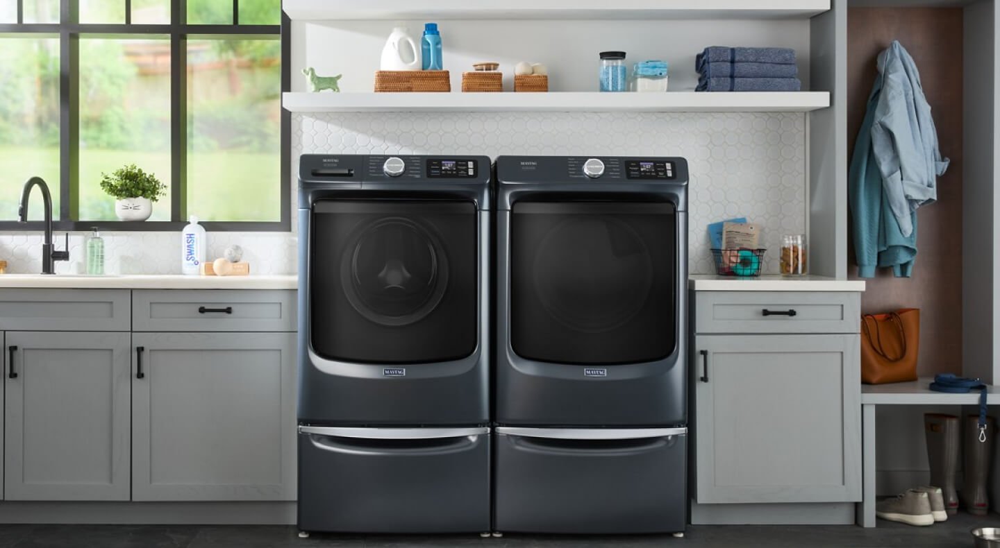 Front load washer and dryer on laundry pedestals
